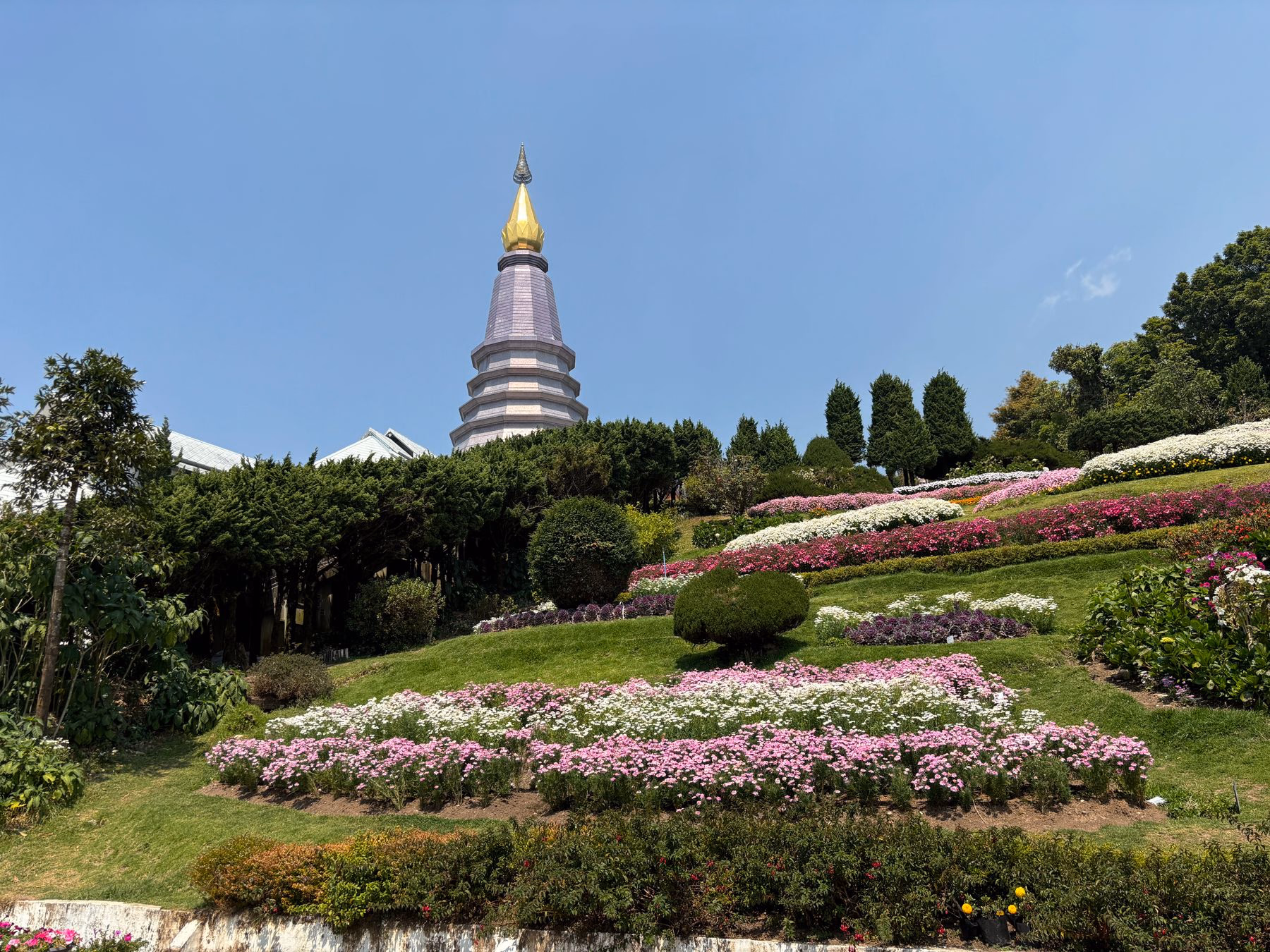 Landscaped gardens and a golden-topped pagoda at Doi Suthep in Chiang Mai